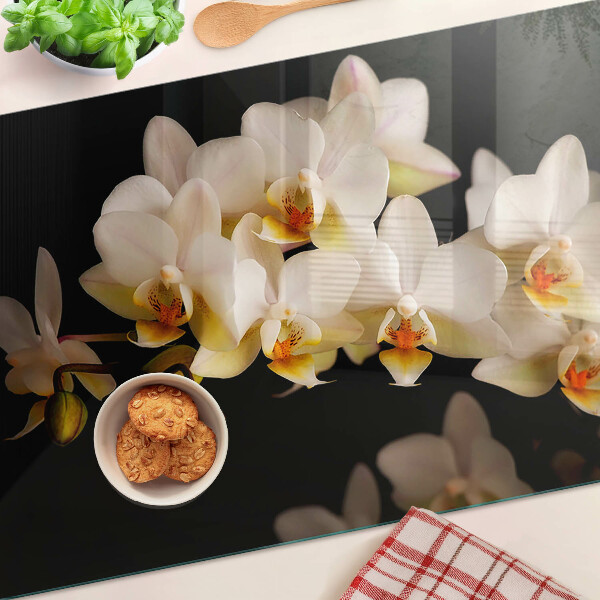 Sklenená doska na krájanie Orchidey na čiernom pozadí