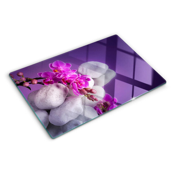Doska na krájanie Kvety orchideí na pozadí kameňov