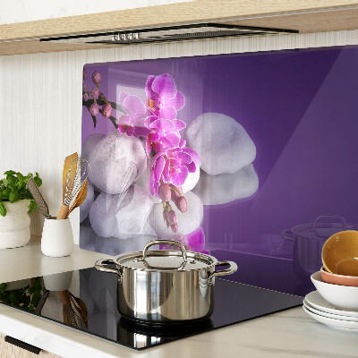 Doska na krájanie Kvety orchideí na pozadí kameňov