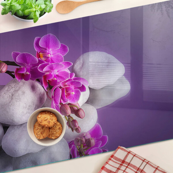 Doska na krájanie Kvety orchideí na pozadí kameňov