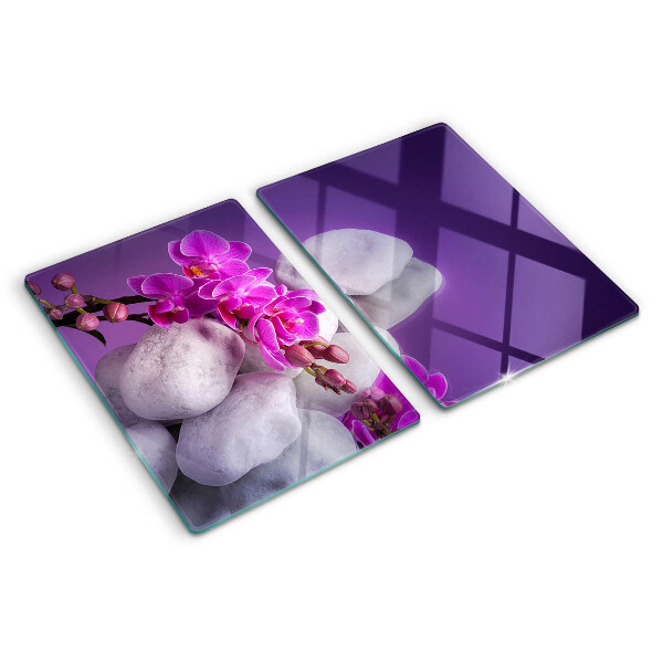 Doska na krájanie Kvety orchideí na pozadí kameňov