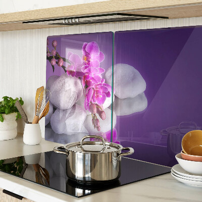 Doska na krájanie Kvety orchideí na pozadí kameňov