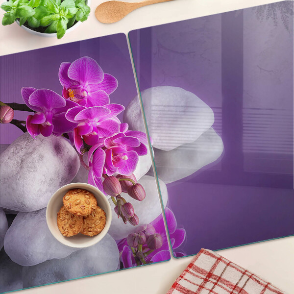Doska na krájanie Kvety orchideí na pozadí kameňov