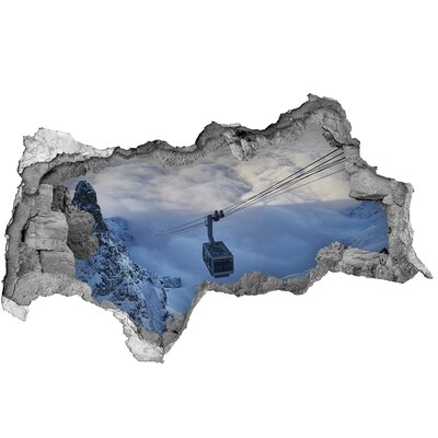 Diera 3D v stene nálepka Horská lanovka nad oblakmi