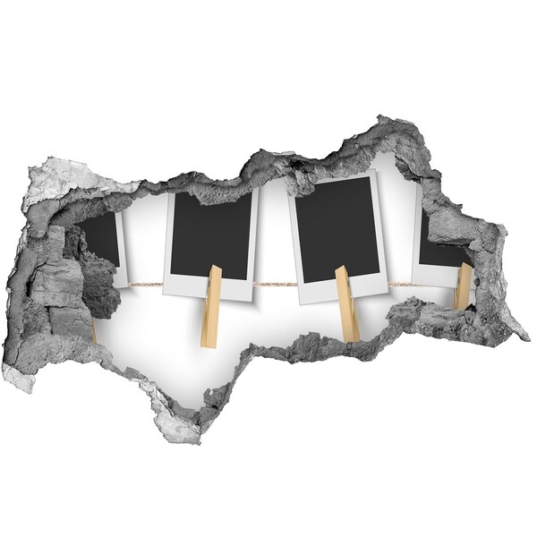 Foto fotografie diera na stenu Poškodená stena s obrazovými rámami