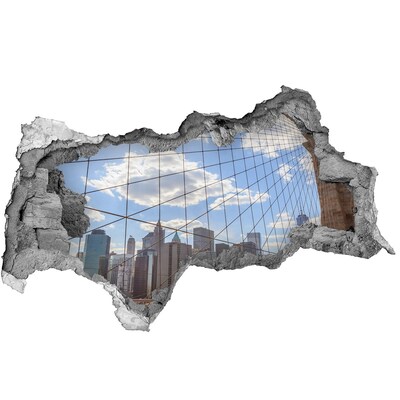 Fototapeta diera na stenu 3D Pohľad na mesto cez dieru v stene