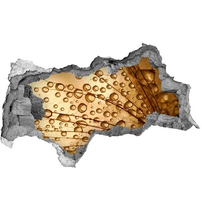 Samolepiaca nálepka Zlatá kvapka na betónovom pozadí