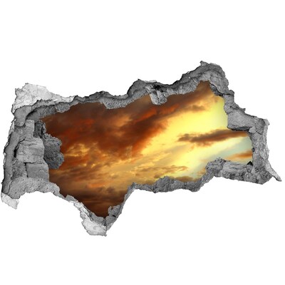 Fototapeta diera na stenu Západ slnka cez dieru v stene