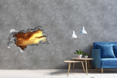 Fototapeta diera na stenu Západ slnka cez dieru v stene