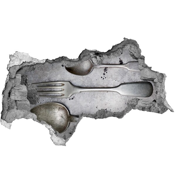 Fototapeta diera na stenu Rozbitá stena s výhľadom na príbory