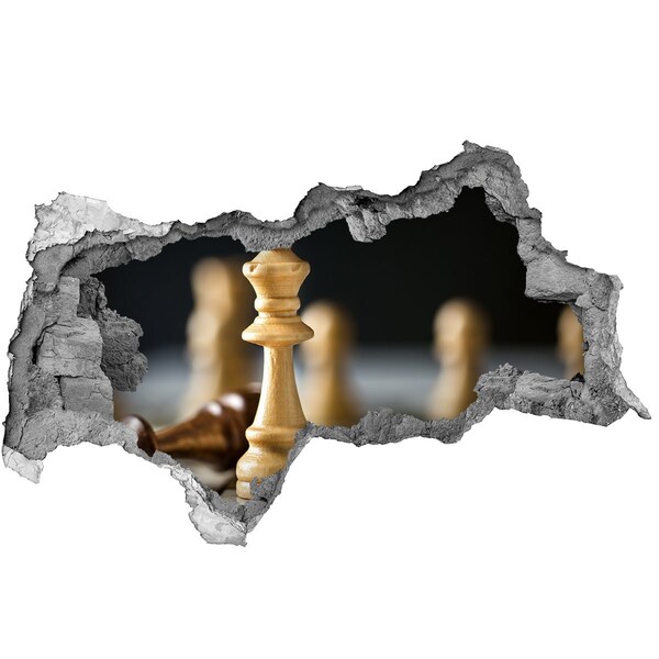 Foto fotografie diera na stenu Hranie šachu cez dieru v stene