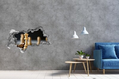 Foto fotografie diera na stenu Hranie šachu cez dieru v stene