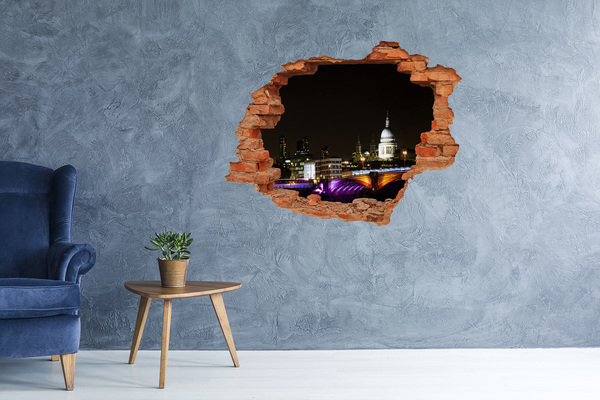 Foto fotografie diera na stenu Nočný pohľad na Londýn cez dieru v stene