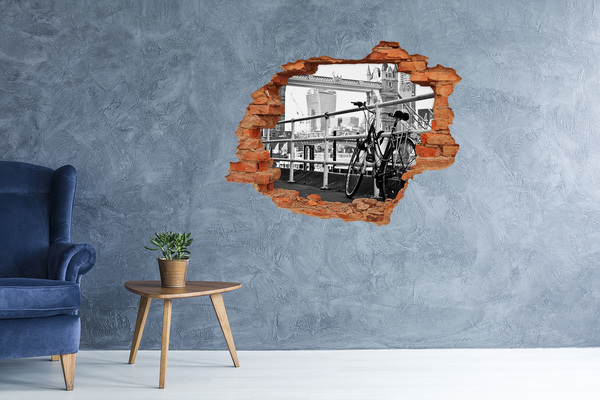 Diera 3D v stene nálepka Bicykel na mestskom nábreží