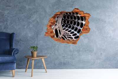 Foto fotografie diera na stenu Kovová sieť cez otvor v stene