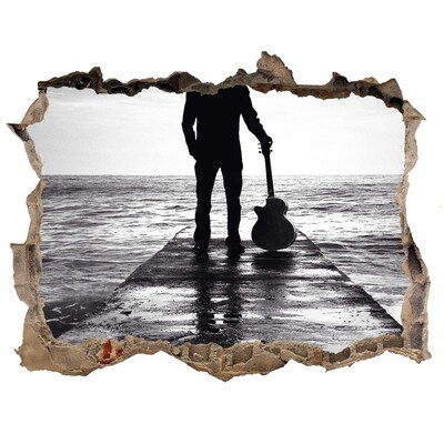 Fototapeta díra na zeď Hudobník na móle