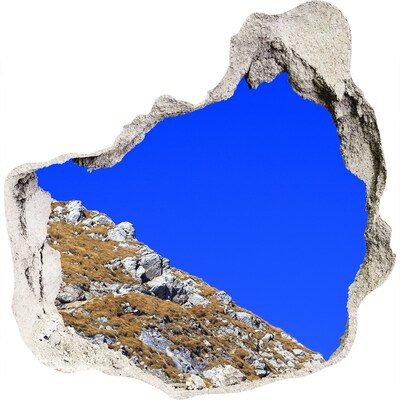 Fototapeta diera na stenu Horská krajina cez dieru v stene