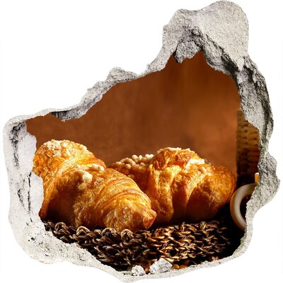 Foto fotografie diera na stenu Lahodné croissanty v diere v stene