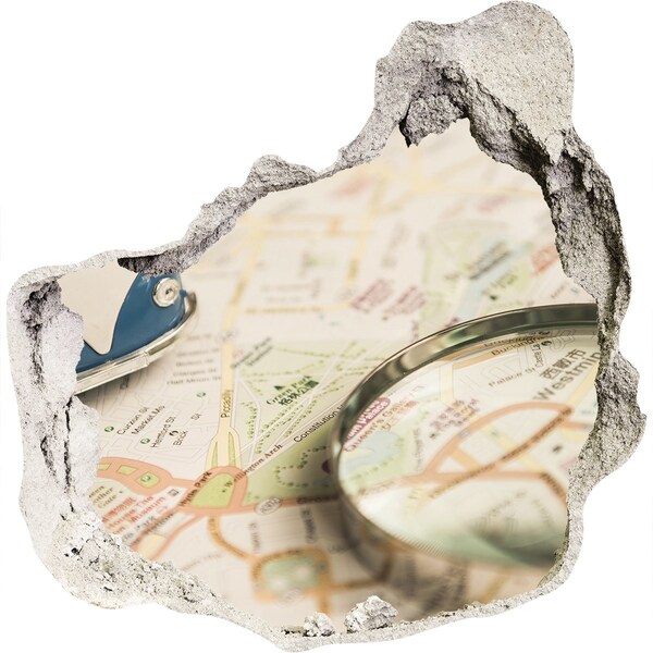 Fototapeta diera na stenu Mapa s lupou v diere v stene