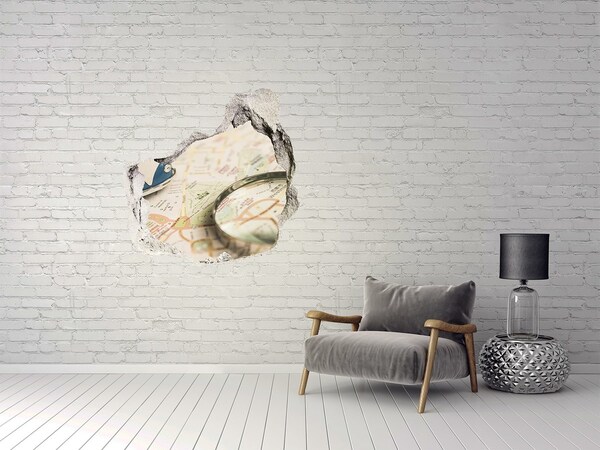 Fototapeta diera na stenu Mapa s lupou v diere v stene
