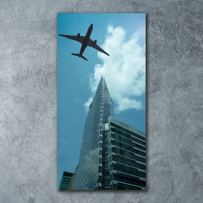Vertikálny foto obraz akrylový Lietadlo nad mestom