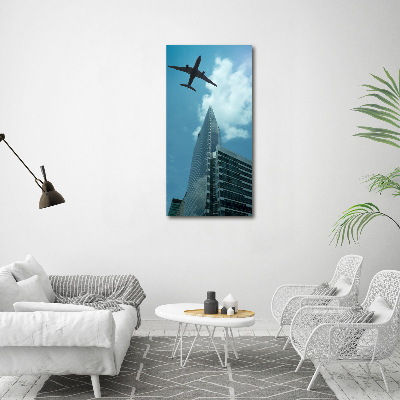 Vertikálny foto obraz akrylový Lietadlo nad mestom