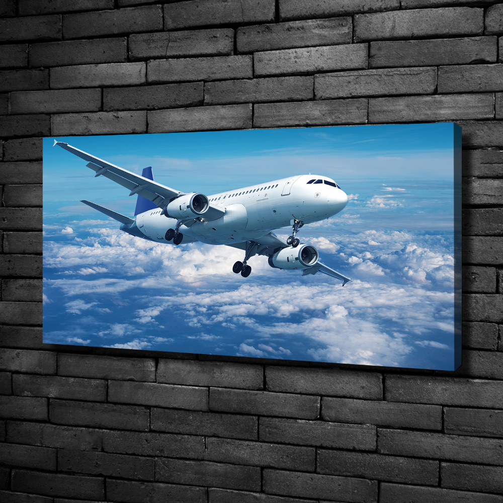 Foto-obraz canvas do obývačky Lietadlo v oblakoch