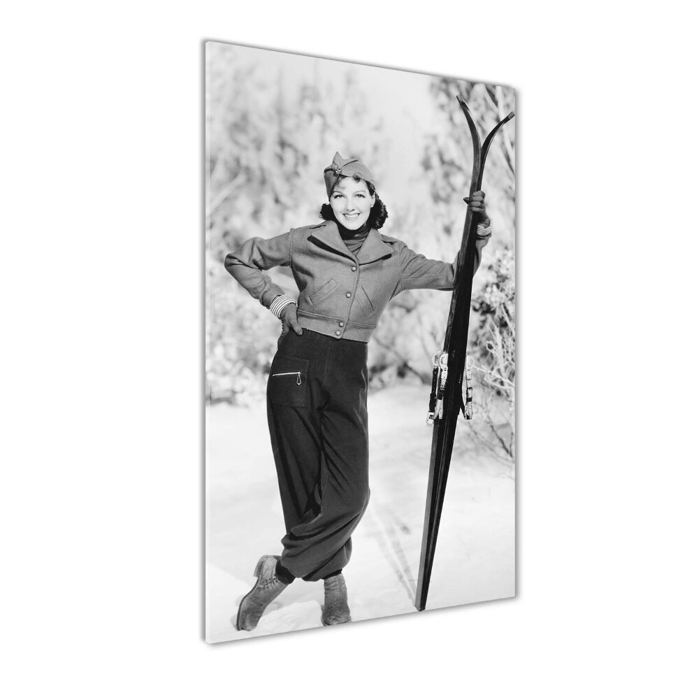 Vertikálny fotoobraz na skle Žena s lyžami