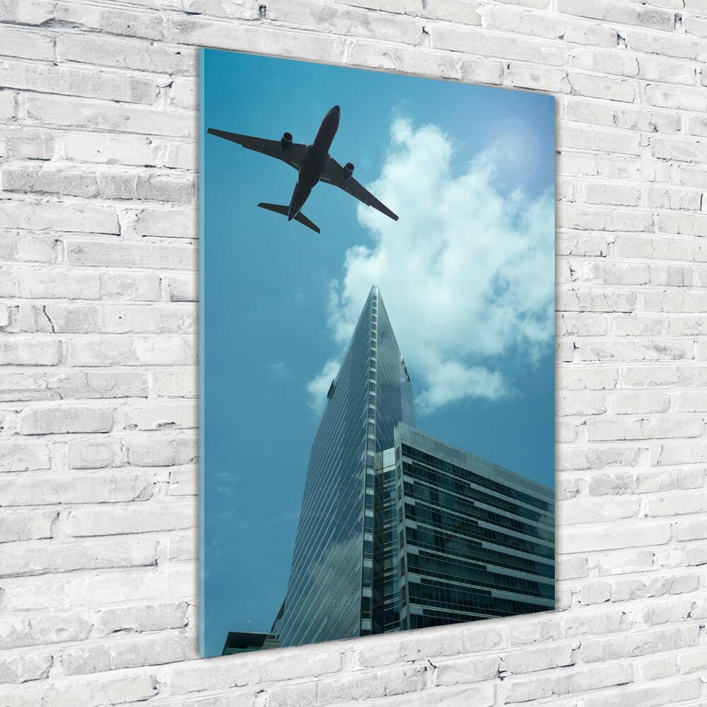 Vertikálny foto obraz fotografie na skle Lietadlo nad mestom