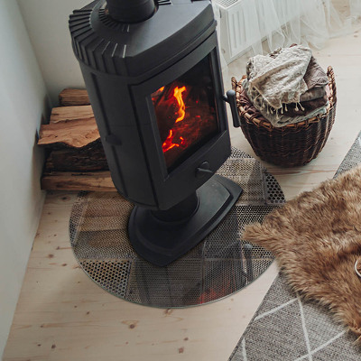 Okrúhla sklenená podložka pod krb Motív perforovanej ocele