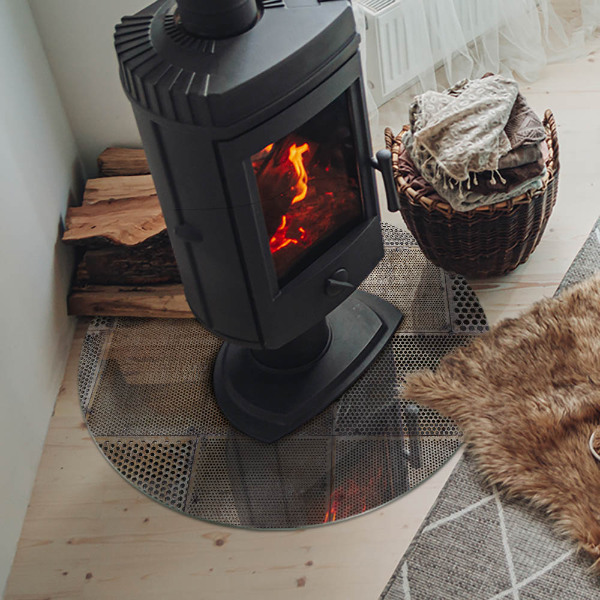 Okrúhla sklenená podložka pod krb Motív perforovanej ocele