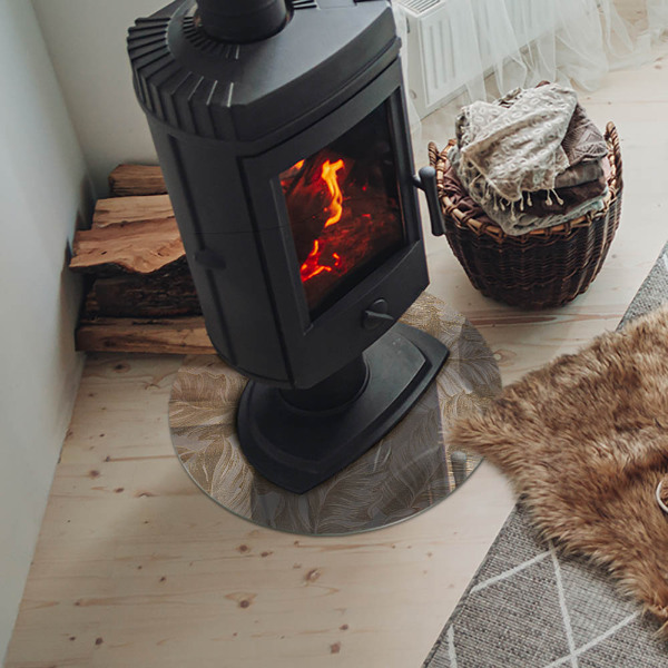 Okrúhla sklenená podložka pod krb Jemné vzory listov