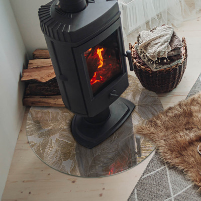 Okrúhla sklenená podložka pod krb Jemné vzory listov