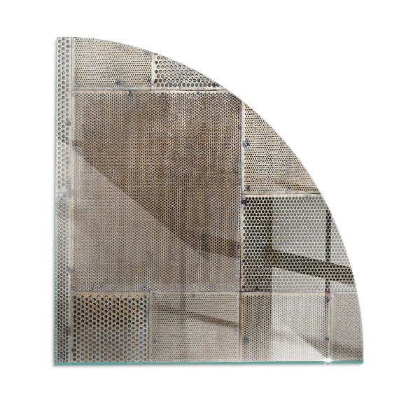 Rohová sklenená podložka pod krb Motív perforovanej ocele